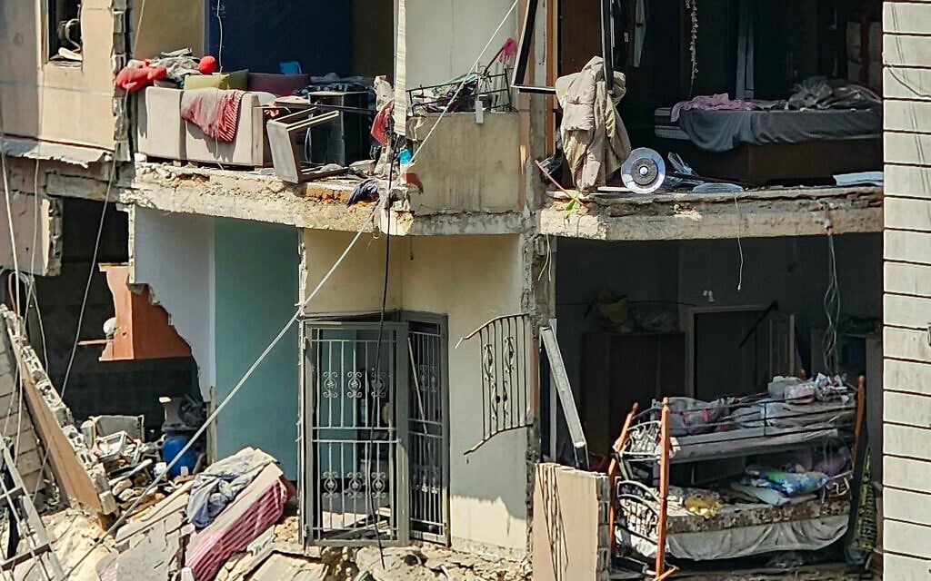 Heavily damaged apartments are seen among collapsed building at the site of an overnight Israeli airstrike in Beirut's southern suburbs on June 6, 2025. Israel said it targeted Hezbollah drone manufacturing facilities. (Photo by AFP)