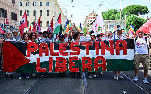 Protesters hold a banner reading "Free Palestine" as they join a demonstration called by Italian opposition parties in support of Palestinians amid the war in Gaza, in Rome, on June 7, 2025. (Tiziana Fabi/AFP) Protesters hold a banner reading "Free Palestine" as they join a demonstration called by Italian opposition parties in support of Palestinians amid the war in Gaza, in Rome, on June 7, 2025. (Tiziana Fabi/AFP)