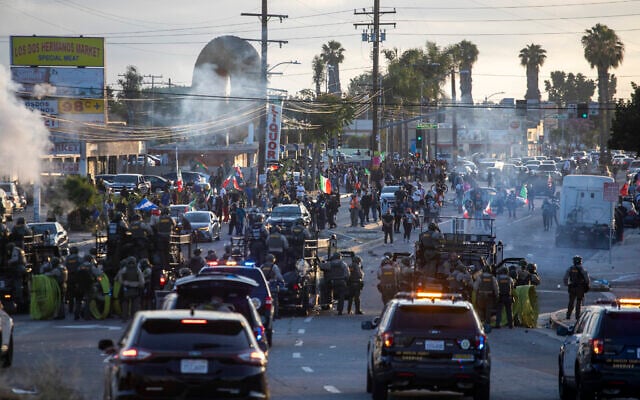 Law enforcement clashes with demonstrators during a protest following federal immigration operations, in the Compton neighborhood of Los Angeles, California, on June 7, 2025 (RINGO CHIU / AFP)