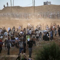 Gazans gather relief supplies at a distribution center run by the Gaza Humanitarian Foundation in the central Gaza Strip on June 8, 2025. (Eyad BABA / AFP)