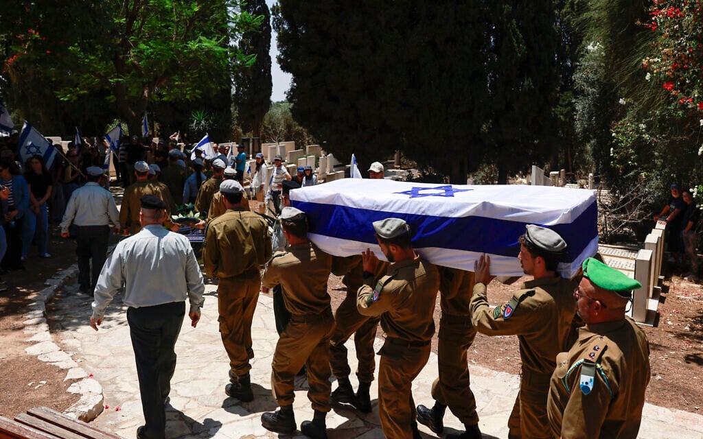 Soldiers carry the flag-draped coffin of IDF Staff Sgt. Yoav Raver, who was killed in action in the Gaza Strip, during his funeral at the Sde Warburg cemetery in central Israel, on June 8, 2025. (Menahem Kahana / AFP)