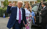 US President Donald Trump (L) raises a fist next to US First Lady Melania Trump during the Congressional Picnic on the South Lawn of the White House in Washington, DC, on June 12, 2025. (Photo by SAUL LOEB / AFP)