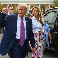 US President Donald Trump (L) raises a fist next to US First Lady Melania Trump during the Congressional Picnic on the South Lawn of the White House in Washington, DC, on June 12, 2025. (Photo by SAUL LOEB / AFP)