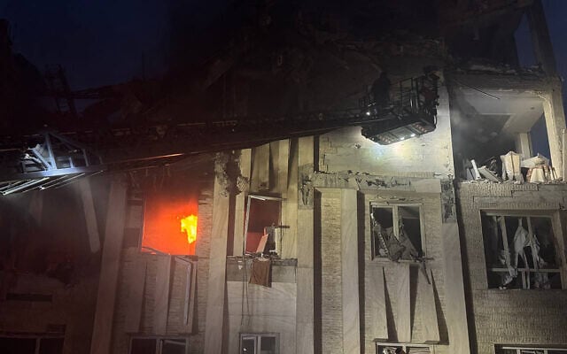This handout photo released by Iran's Revolutionary Guard Corps (IRGC) official Sepah News Telegram channel on June 13, 2025 shows a damaged building in Tehran on fire following Israeli strikes on the Iranian capital (SEPAH NEWS / AFP)