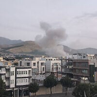 Handout photo released by Iran's Revolutionary Guard Corps' (IRGC) official Sepah News Telegram channel on June 13, 2025 shows smoke billowing from a site apparently targeted by an Israeli strike in the capital Tehran early in the morning. (Sepah News / AFP)