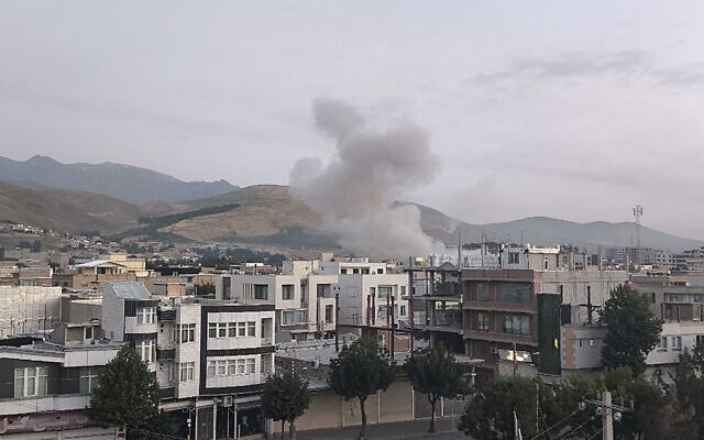 This handout photo released by Iran's Revolutionary Guard Corps (IRGC) official Sepah News Telegram channel on June 13, 2025 shows smoke billowing from a site apparently targeted by an Israeli strike in the Iranian capital Tehran early in the morning (SEPAH NEWS / AFP)