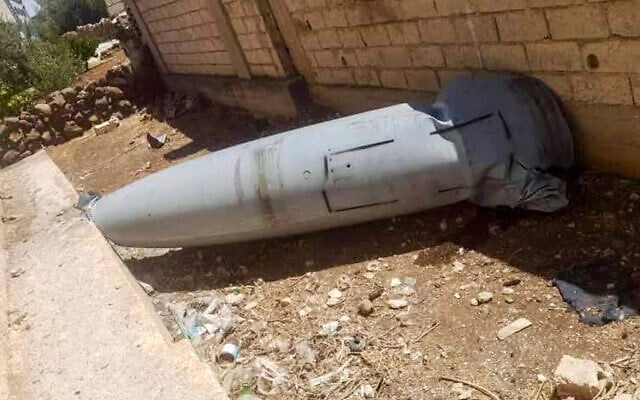 This handout picture released by the official Telegram account of Syria's Daraa province apparently shows the remains of an Iranian projectile that was headed for Israel after it fell in the southwestern Syrian province on June 13, 2025 (Daraa Province Telegram Account / AFP)