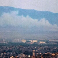 Smoke and fire billow from the site of an alleged Israeli strike in southern Tehran on June 13, 2025. (Atta Kenare/AFP)