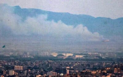 Smoke and fire billow from the site of an alleged Israeli strike in southern Tehran on June 13, 2025. (Atta Kenare/AFP)