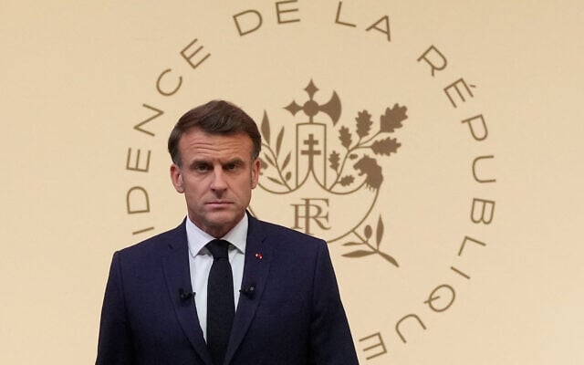 French President Emmanuel Macron arrives to hold a press conference at the Elysee Paslace in Paris on June 13, 2025, after Israel launched a wave of strikes across Iran. (Michel Euler / POOL / AFP)