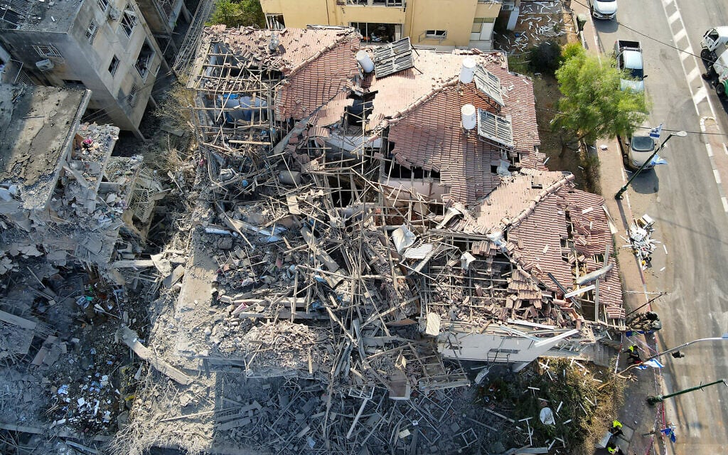 This aerial picture shows damaged buildings at a site hit by a missile fired from Iran in Ramat Gan near Tel Aviv on June 14, 2025.  (Photo by Jack GUEZ / AFP)