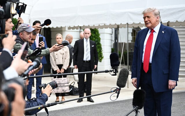 US President Donald Trump speaks to journalists as he makes his way to board Marine One before departing from the South Lawn of the White House in Washington, DC, on June 15, 2025. (Mandel NGAN / AFP) US President Donald Trump speaks to journalists as he makes his way to board Marine One before departing from the South Lawn of the White House in Washington, DC, on June 15, 2025. (Mandel NGAN / AFP)