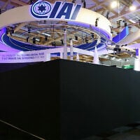 An attendee walks past the closed Israel Aerospace Industries (IAI) Israeli Pavillon during the 55th edition of the International Paris Air Show at the Paris Le Bourget Airport, on June 16, 2025. France on June 16, 2025, blocked access to the stands of five Israeli arms manufacturers at the Paris Air show for displaying "offensive weapons", according to a French government source. (ALAIN JOCARD / AFP)