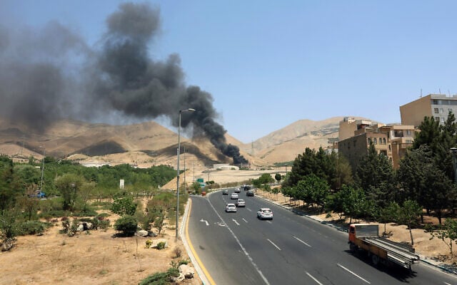 Illustrative: Smoke billows for the second day from the Shahran oil depot, northwest of Tehran, on June 16, 2025. (AFP)