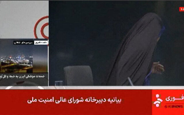 As the Israeli Air Force bombs the offices of Iran’s state broadcaster IRIB in Tehran on June 16, 2025, the anchor is seen fleeing the studio. (Image grab taken from footage broadcast by Iran's IRINN news; IRINN / AFP)