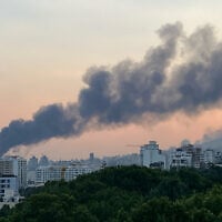 Smoke billows after an Israeli airstrike on the Islamic Republic of Iran Broadcasting (IRIB) building in Tehran on June 16, 2025. (AFP)