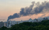 Smoke billows after an Israeli airstrike on the Islamic Republic of Iran Broadcasting (IRIB) building in Tehran on June 16, 2025. (AFP)
