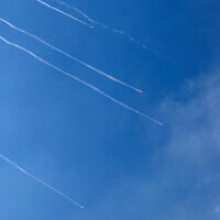 Rocket trails are seen in the sky above the Israeli coastal city of Netanya amid a fresh barrage of Iranian missiles on June 17, 2025. (JACK GUEZ / AFP)