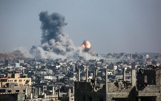 A column of fire and smoke erupts following Israeli strikes of areas east of the Tuffah neighborhood in eastern Gaza City on June 18, 2025. (Bashar TALEB / AFP)
