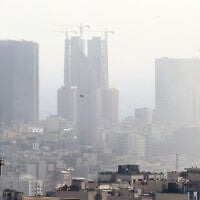 Smoke lingers in the sky above Tehran following an Israeli strike on June 18, 2025. (AFP)
