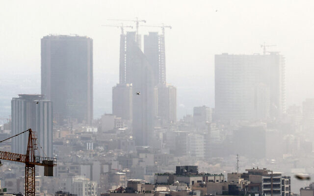 Smoke lingers in the sky above Tehran following an Israeli strike on June 18, 2025. (AFP)