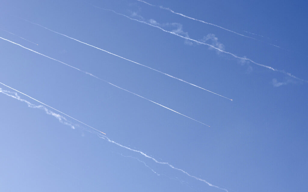 Missile trails are seen in the sky above the coastal city of Netanya amid a fresh barrage of Iranian missile attacks on June 19, 2025 (JACK GUEZ / AFP)
