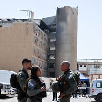 Israeli troops stand outside Soroka Hospital in the southern city of Beersheba, after it was hit by a missile fired from Iran on June 19, 2025. (Marc Israel SELLEM / POOL / AFP)