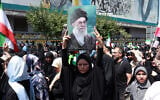 An Iranian carries a portrait of Iran's Supreme Leader Ayatollah Ali Khamenei during an anti-Israeli rally in Tehran on June 20, 2025. (AFP)