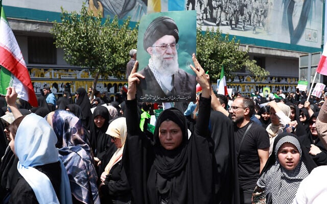 An Iranian carries a portrait of Iran's Supreme Leader Ayatollah Ali Khamenei during an anti-Israeli rally in Tehran on June 20, 2025. (AFP) An Iranian carries a portrait of Iran's Supreme Leader Ayatollah Ali Khamenei during an anti-Israeli rally in Tehran on June 20, 2025. (AFP)