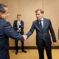 Britain's Foreign Secretary David Lammy (R) and Germany's Foreign Minister Johann Wadephul (2nd R) greet Iran's Foreign Minister Abbas Araghchi (L) prior to a meeting on Tehran's nuclear program, at the Intercontinental Hotel in Geneva, Switzerland, June 20, 2025. (Handout / German Federal Foreign Office / AFP)