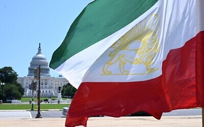 The old flag of Iran used prior to the 1979 Islamic Revolution stands on the National Mall in front of the US Capitol in Washington, DC, on June 20, 2025. (Alex WROBLEWSKI / AFP)