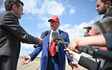 US President Donald Trump speaks to the press upon arrival at Morristown Municipal Airport in Morristown, New Jersey, on June 20, 2025. Trump is heading to his Bedminster golf resort for a MAGA Inc. fundraising dinner. (Photo by Mandel NGAN / AFP)