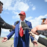US President Donald Trump speaks to the press upon arrival at Morristown Municipal Airport in Morristown, New Jersey, on June 20, 2025. Trump is heading to his Bedminster golf resort for a MAGA Inc. fundraising dinner. (Photo by Mandel NGAN / AFP)