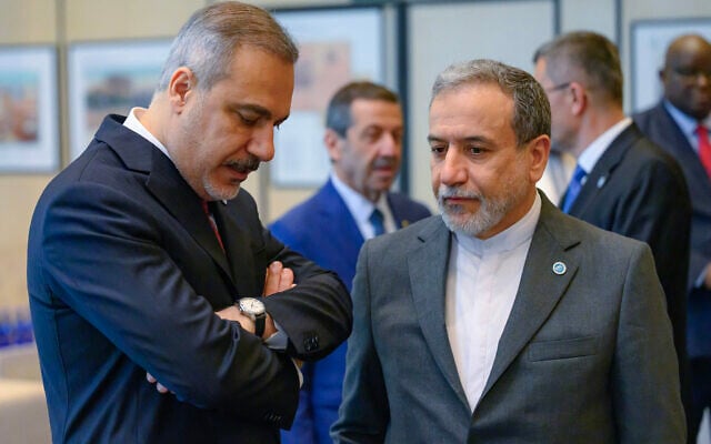 Iranian Foreign Minister Abbas Araghchi (right) speaks with Turkish Foreign Minister Hakan Fidan at the council of foreign ministers of the Organization of Islamic Cooperation in Istanbul, Turkey, June 21, 2025. (Yasin Akgul/AFP)