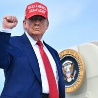 US President Donald Trump pumps his fist as he boards Air Force One at Morristown Municipal Airport in Morristown, New Jersey, on June 21, 2025, as he returns to the White House from his golf club in Bedminster, New Jersey. (Mandel Ngan/AFP)