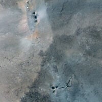 This handout satellite picture provided by Maxar Technologies and taken on June 22, 2025, shows Iran's Fordow Fuel Enrichment Plant (FFEP), northeast of the city of Qom, after US strikes on the site. (Satellite image ©2025 Maxar Technologies / AFP)