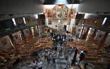 People and rescuers inspect the damage at the site of a reported suicide attack at the Saint Elias church in Damascus's Dwelaa area on June 22, 2025. (LOUAI BESHARA / AFP)