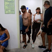 People gather in a underground shelter in Tel Aviv on June 23, 2025, after sirens sounded across the country as missiles were fired from Iran (Menahem Kahana / AFP)
