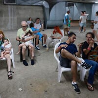 People gather in a underground shelter in Tel Aviv on June 24, 2025, after sirens sounded in several areas across the country after missiles were fired from Iran (Menahem Kahana / AFP)
