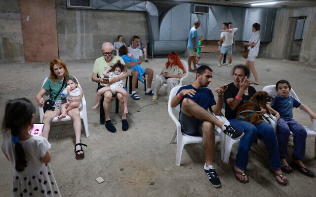 People gather in a underground shelter in Tel Aviv on June 24, 2025, after sirens sounded in several areas across the country after missiles were fired from Iran (Menahem Kahana / AFP)