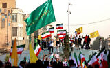 Iranians chant slogans and wave national flags as they celebrate a ceasefire between Iran and Israel at Enghlab Square in the capital Tehran on June 24, 2025. (ATTA KENARE / AFP)