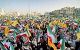 Iranians wave national flags and chant slogans as they celebrate a ceasefire between Iran and Israel at Enghlab Square in the capital Tehran on June 24, 2025. (ATTA KENARE / AFP)