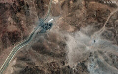 This handout satellite picture provided by Maxar Technologies and taken on June 24, 2025, shows new airstrike craters at a perimeter installation on Iran's Fordo nuclear facility, northeast of the city of Qom. (Satellite image ©2025 Maxar Technologies/AFP)
