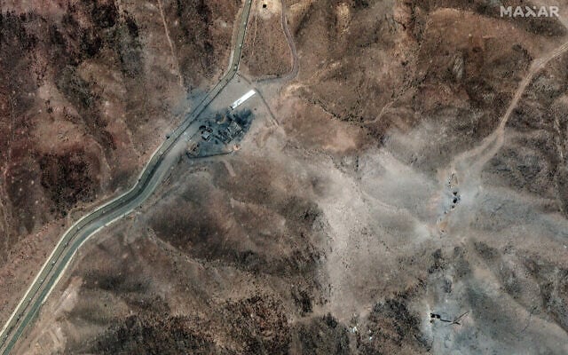 This handout satellite picture provided by Maxar Technologies and taken on June 24, 2025, shows new airstrike craters at a perimeter installation on Iran's Fordo nuclear facility, northeast of the city of Qom. (Satellite image ©2025 Maxar Technologies/AFP)