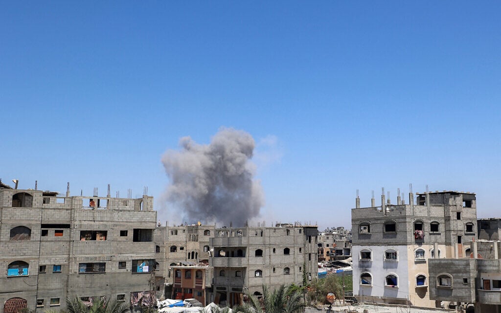 A smoke plume rises following an Israeli airstrike on a building in eastern Bureij in the central Gaza Strip on June 25, 2025. (Eyad BABA / AFP)