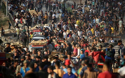 Palestinians gather at an aid distribution point set up by the Gaza Humanitarian Foundation (GHF), near the Nuseirat refugee camp in the central Gaza Strip on June 25, 2025. (Eyad BABA / AFP) Palestinians gather at an aid distribution point set up by the Gaza Humanitarian Foundation (GHF), near the Nuseirat refugee camp in the central Gaza Strip on June 25, 2025. (Eyad BABA / AFP)