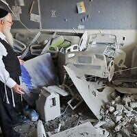 Rabbi Yehuda Mamorstein, CEO and founder of ALEH, stands amid the rubble of the organization's facility in Bnei Brak, following a deadly Iranian missile attack, June 17, 2025. (ALEH)