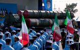 A Russian-made S-300 air defense system is carried on a truck in front of a portrait of the Iranian Supreme Leader Ayatollah Ali Khamenei during an annual armed forces parade just outside Tehran, Iran, September 21, 2024. (Vahid Salemi/AP)