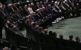 Iranian top officials attend a memorial at the parliament in Tehran, Iran, Wednesday, May 21, 2025, for the late President Ebrahim Raisi and several officials, who were killed in a helicopter crash in the country's northwest last year. (AP Photo/Vahid Salemi)