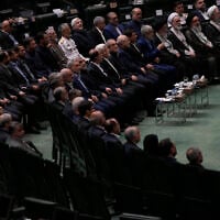 Iranian top officials attend a memorial at the parliament in Tehran, Iran, Wednesday, May 21, 2025, for the late President Ebrahim Raisi and several officials, who were killed in a helicopter crash in the country's northwest last year. (AP Photo/Vahid Salemi)